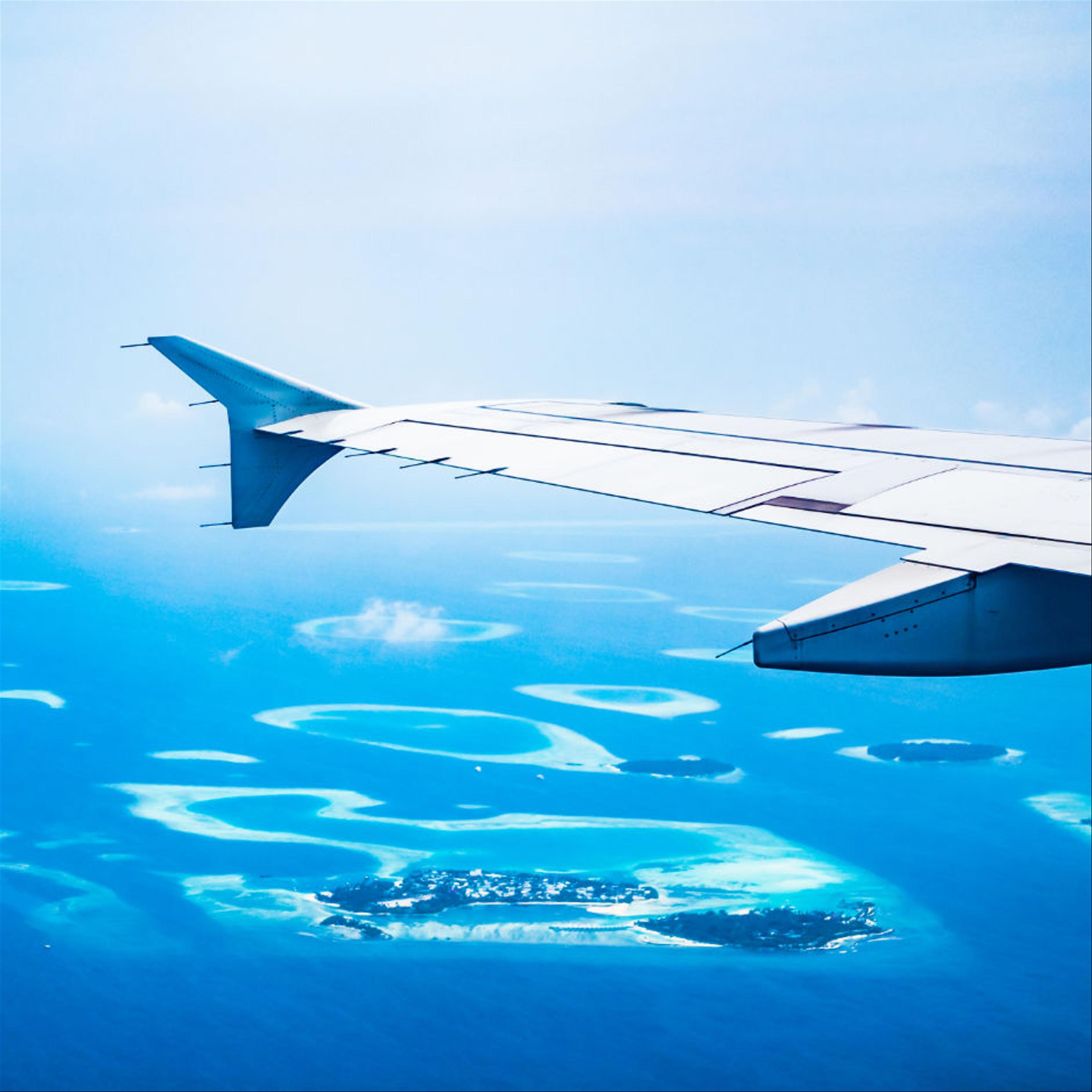 View of an airplane flying over the Bahamas